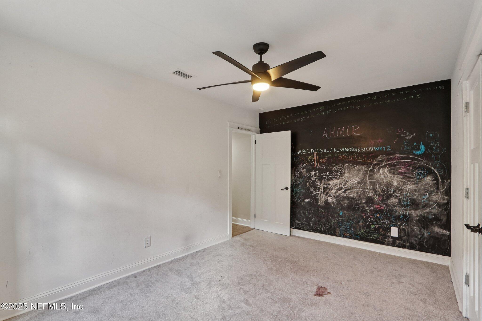 1536 Mayfair Road Jacksonville, FL 32207 - Photo 41 of 58 a view of a ceiling fan and window in a room