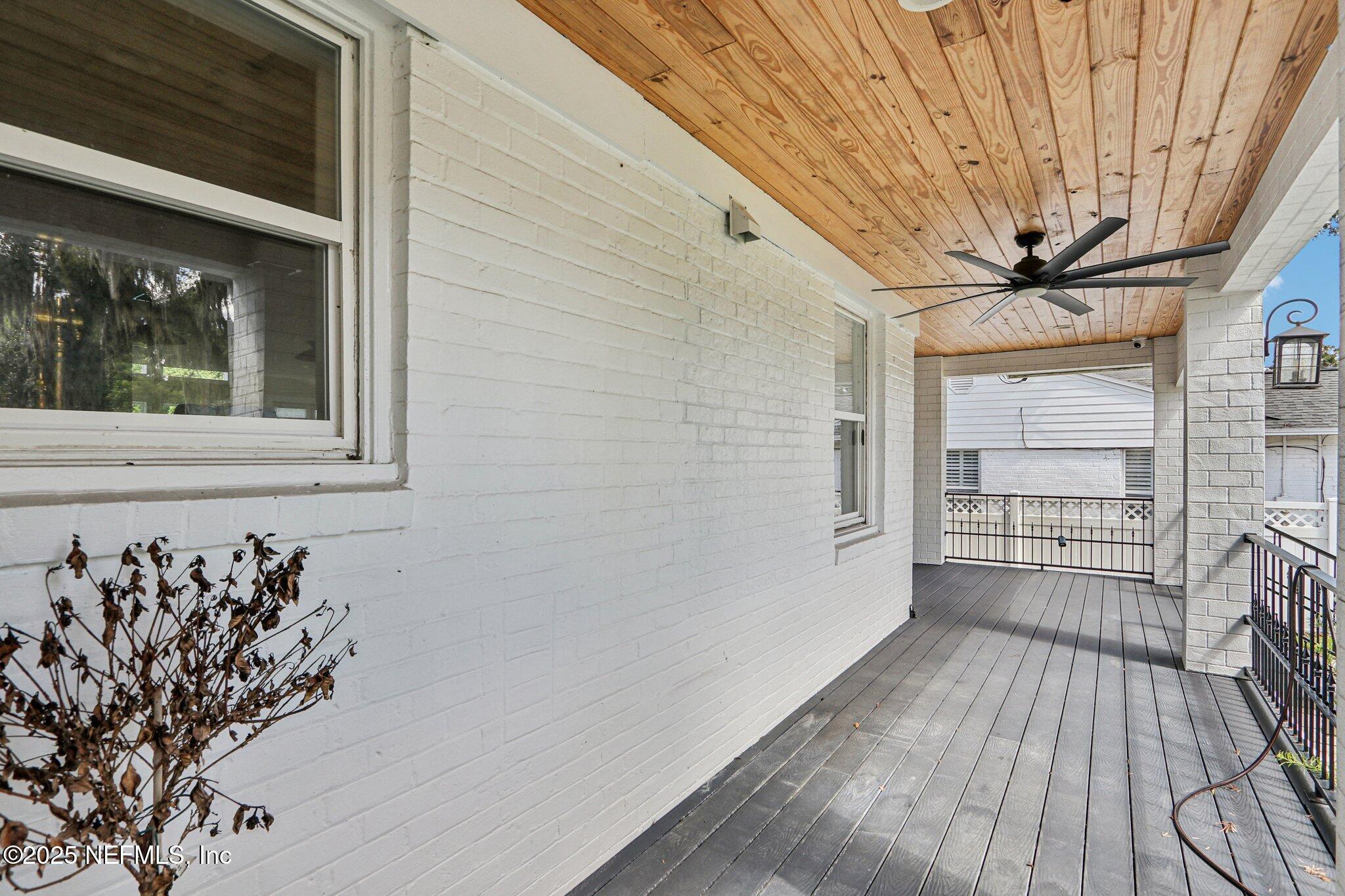1536 Mayfair Road Jacksonville, FL 32207 - Photo 5 of 58 a view of a livingroom with wooden floor and a ceiling fan