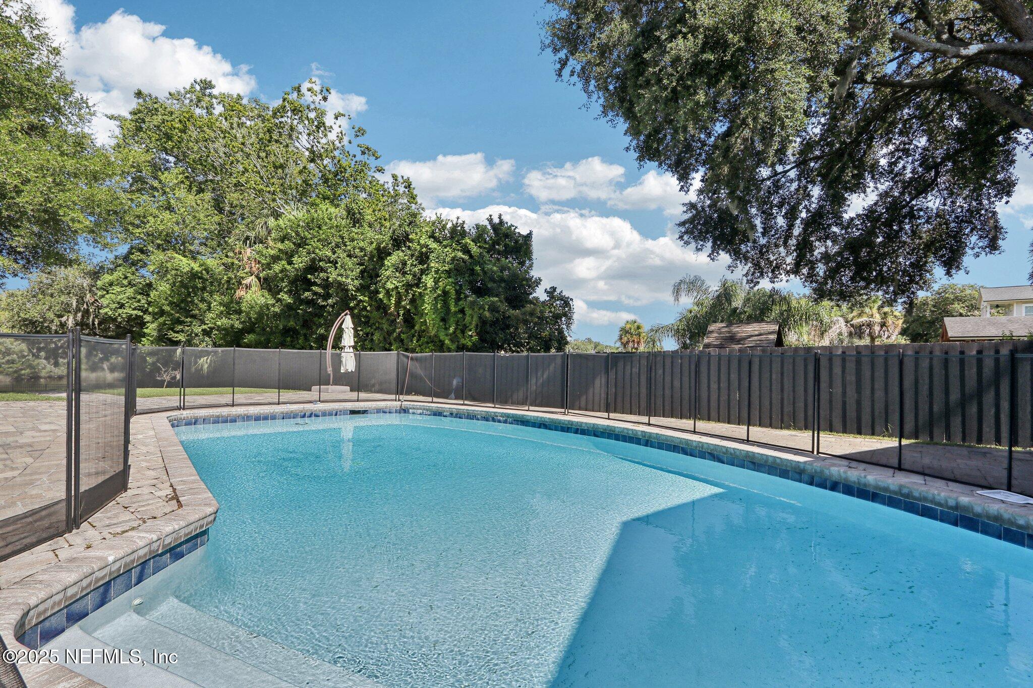 1536 Mayfair Road Jacksonville, FL 32207 - Photo 52 of 58 a view of a backyard with fence and trees