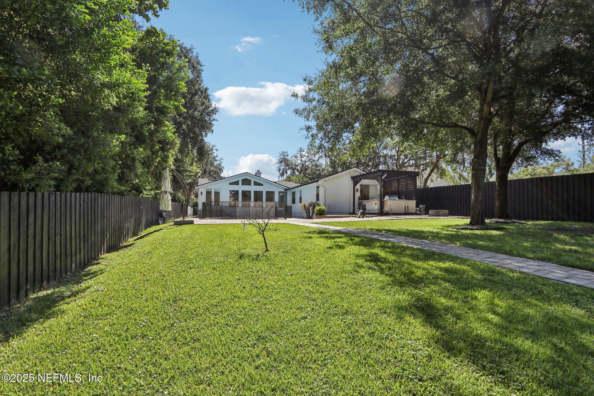 1536 Mayfair Road Jacksonville, FL 32207 - Photo 56 of 58 a swimming pool with outdoor seating and yard