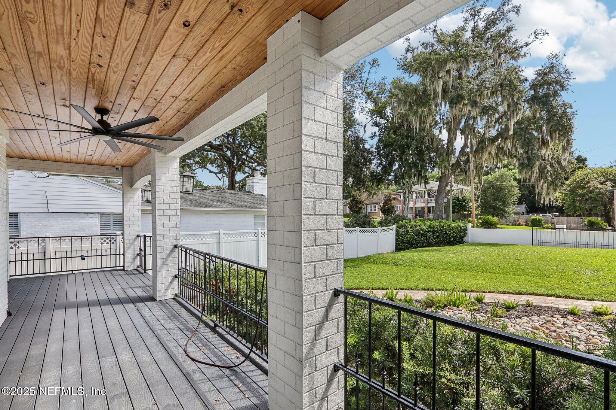 1536 Mayfair Road Jacksonville, FL 32207 - Photo 6 of 58 a view of a porch with wooden floor and fence