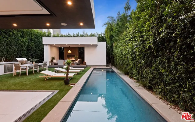 a view of swimming pool with outdoor seating