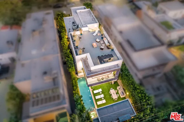 an aerial view of a house with a garden