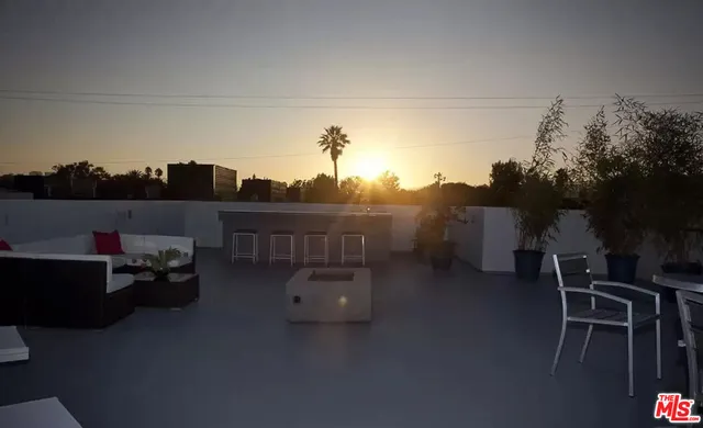 a terrace of a house with outdoor seating