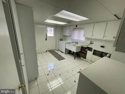 a kitchen with a sink and cabinets