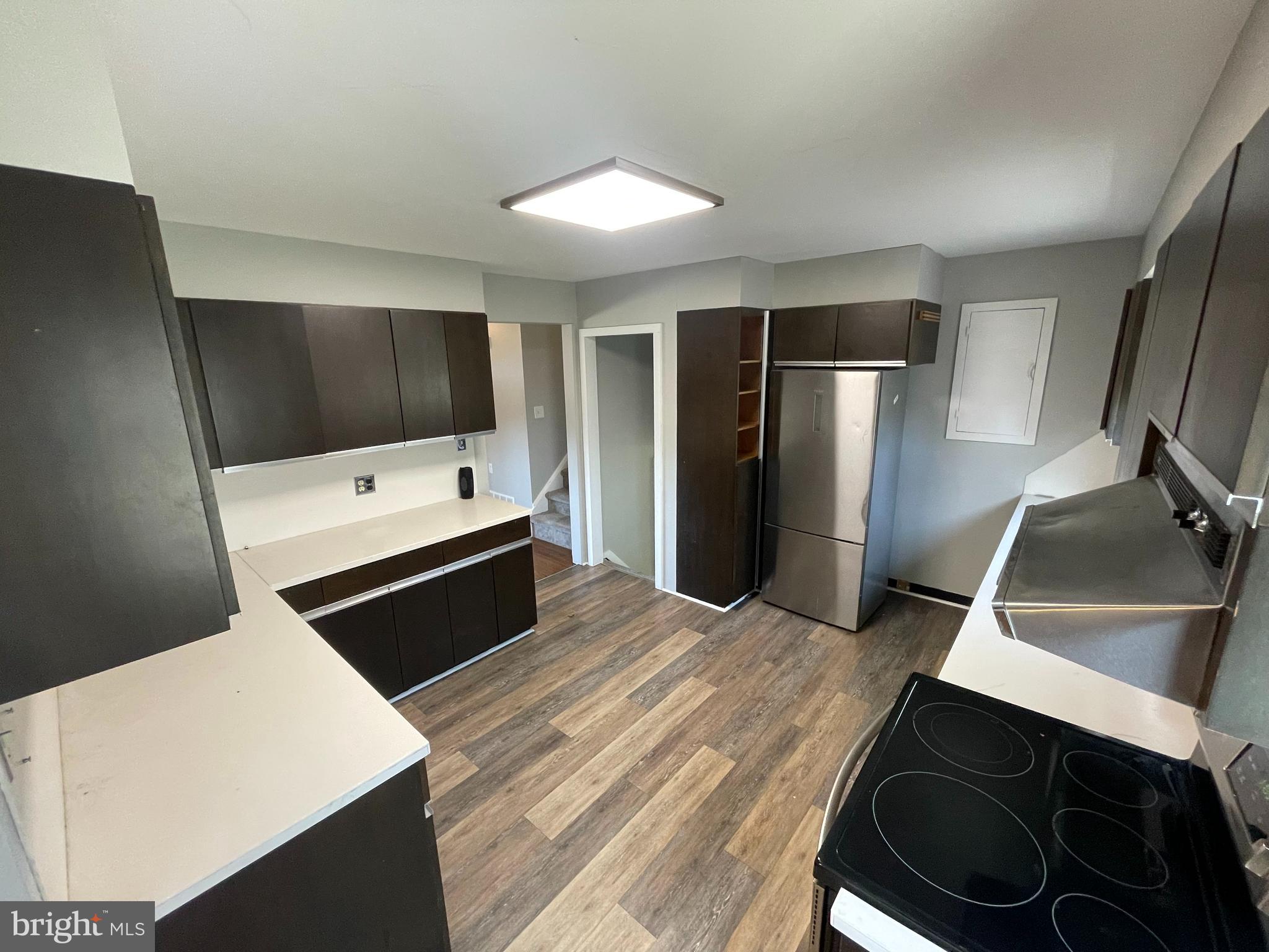 189 Morris Road Harleysville, PA 19438 - Photo 5 of 33 a kitchen with stainless steel appliances a refrigerator and a stove top oven