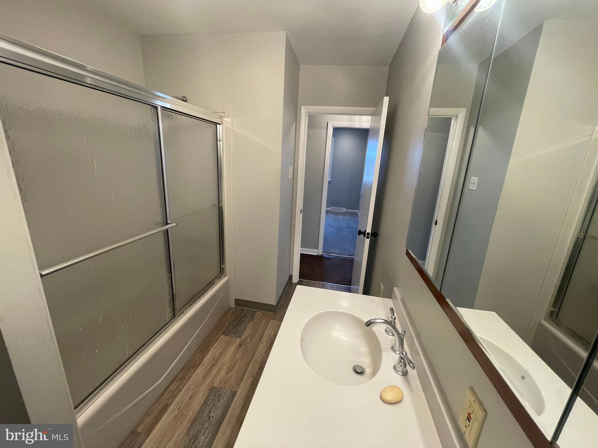 189 Morris Road Harleysville, PA 19438 - Photo 10 of 33 a bathroom with a sink and glass door shower