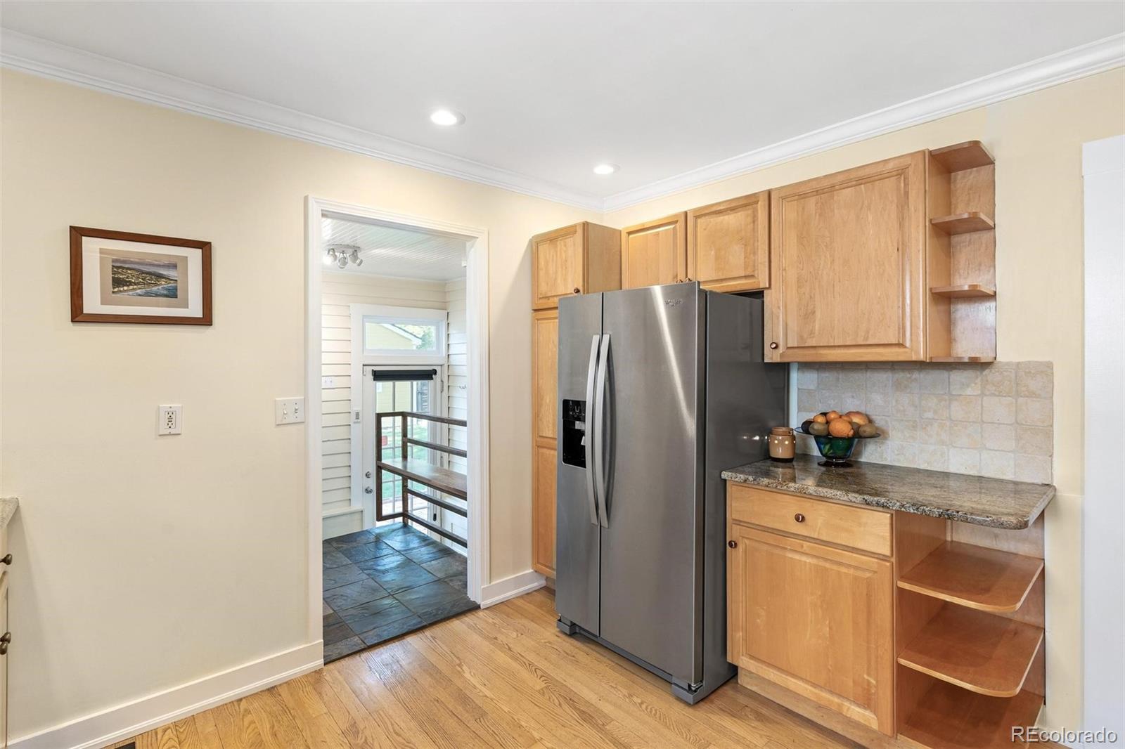 3902 Xavier Street Denver, CO 80212 - Photo 12 of 27 a kitchen with stainless steel appliances a refrigerator and cabinets