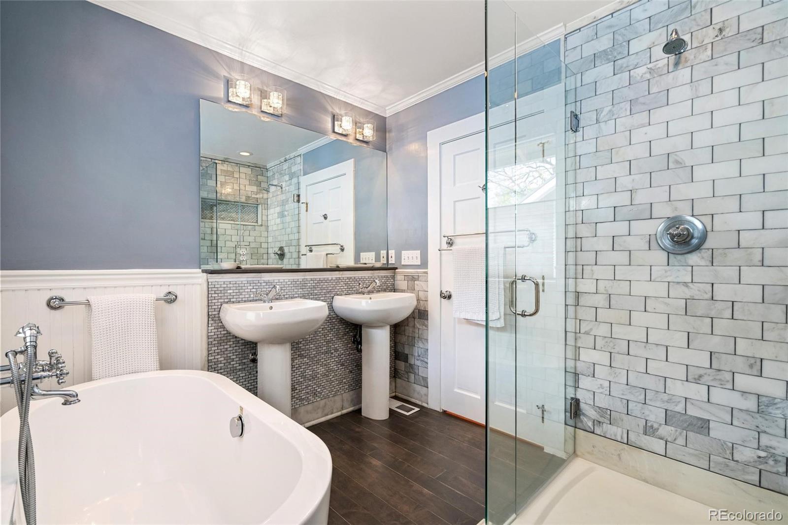 3902 Xavier Street Denver, CO 80212 - Photo 16 of 27 a bathroom with a sink a toilet and shower
