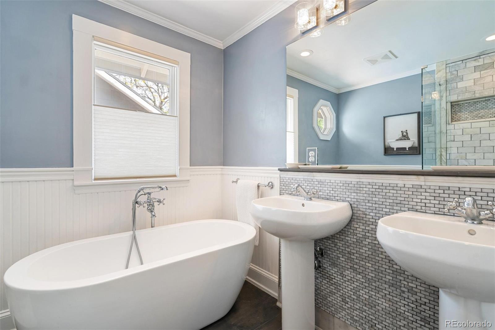 3902 Xavier Street Denver, CO 80212 - Photo 17 of 27 a bathroom with a sink and a bathtub
