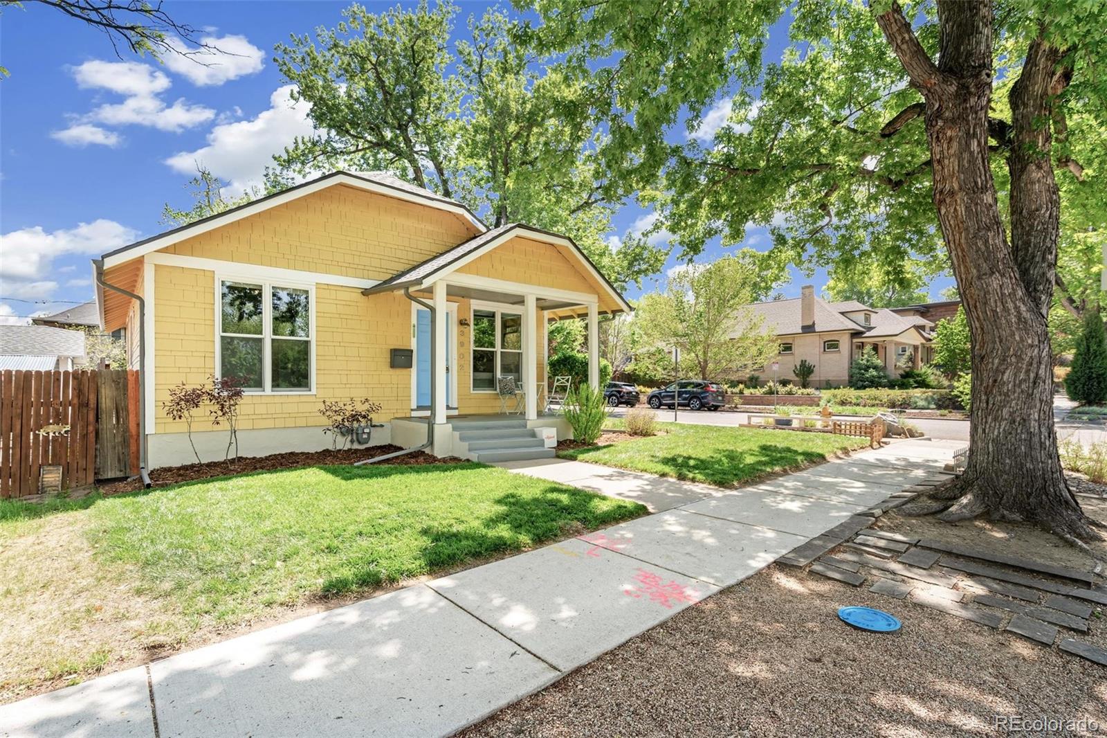 3902 Xavier Street Denver, CO 80212 - Photo 2 of 27 a front view of a house with a yard