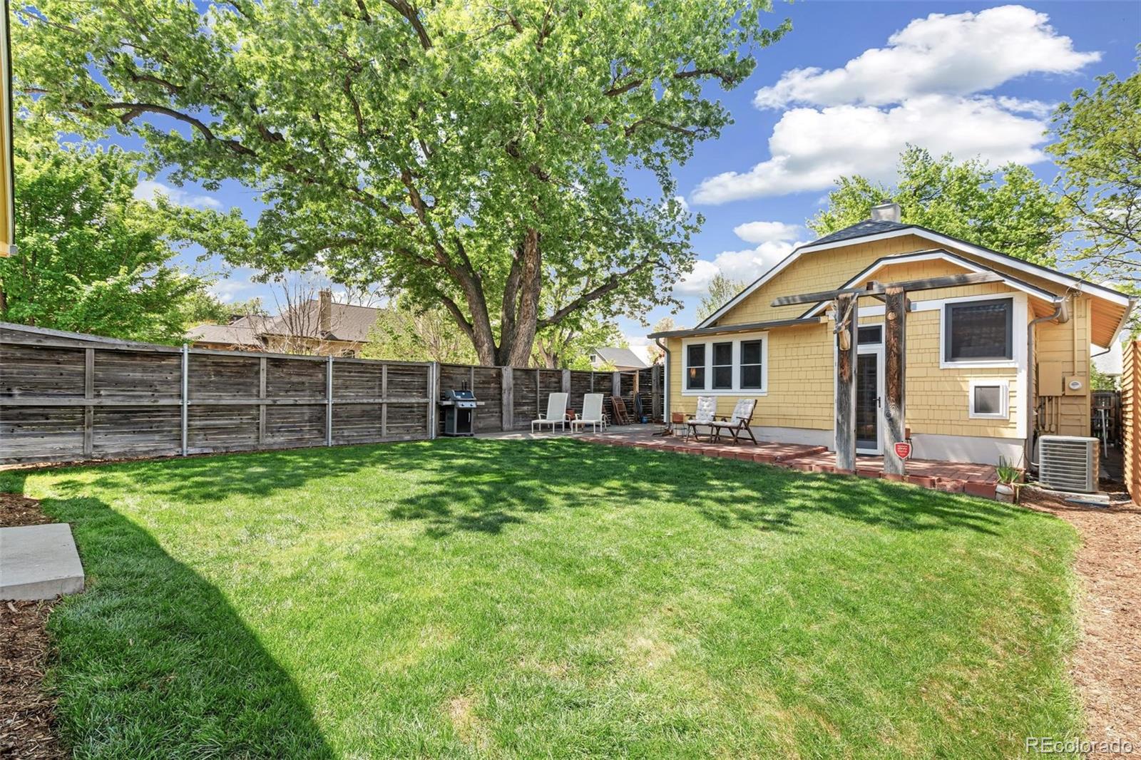 3902 Xavier Street Denver, CO 80212 - Photo 21 of 27 a view of a house with a backyard