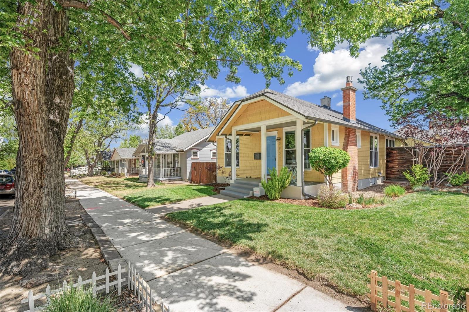 3902 Xavier Street Denver, CO 80212 - Photo 3 of 27 a front view of a house with garden