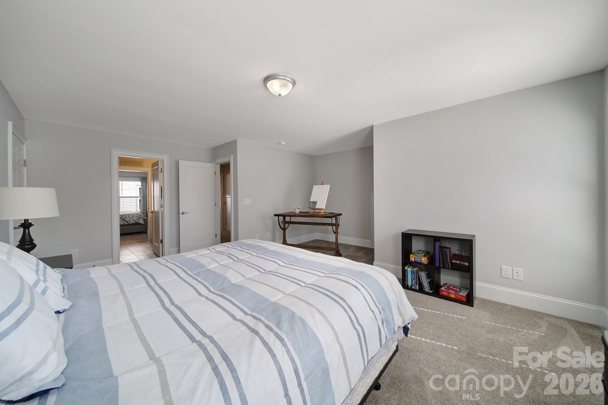 1633 Half Pint Loop Fort Mill, SC 29708 - Photo 22 of 48 a bedroom with a bed and a lamp