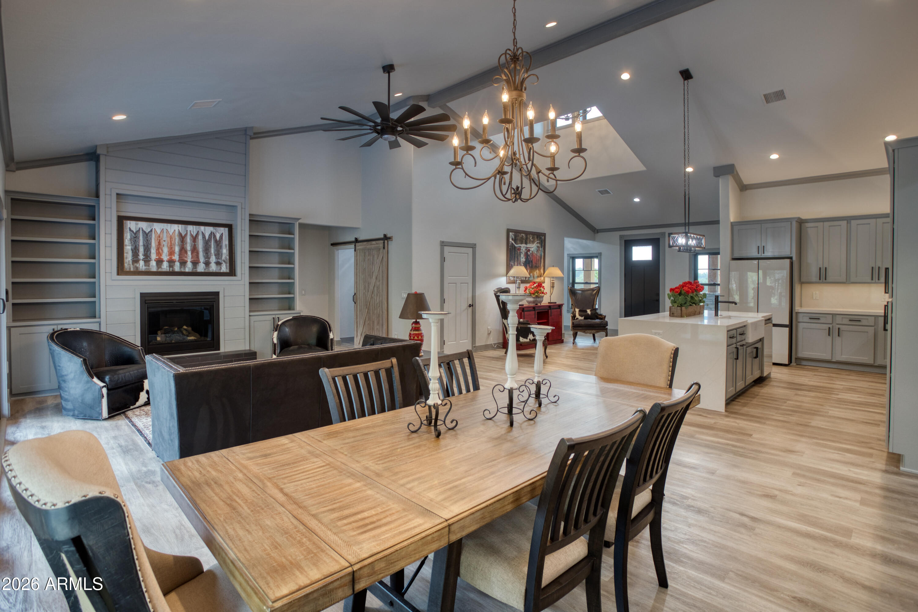 2281 West Edgewater Show Low, AZ 85901 - Photo 16 of 46 a view of a dining room with furniture a chandelier and wooden floor