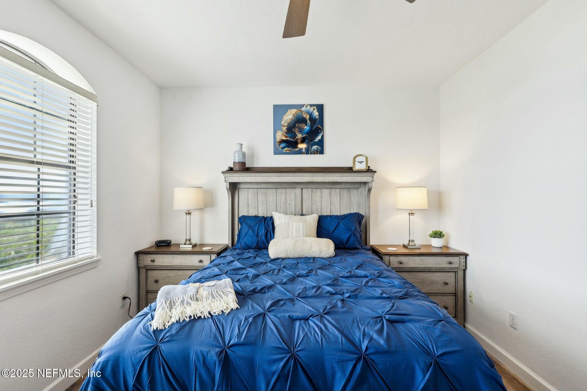 2102 Vista Cove Road St. Augustine, FL 32084 - Photo 15 of 40 a bedroom with a bed and a window