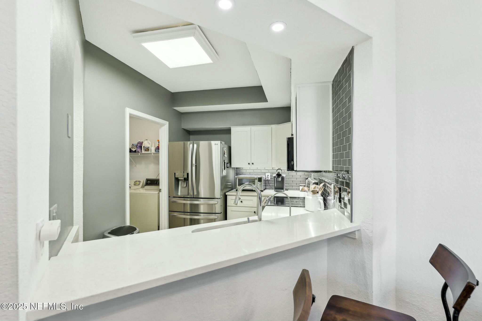 2102 Vista Cove Road St. Augustine, FL 32084 - Photo 10 of 40 a bathroom with a double vanity sink and a mirror