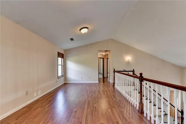 an empty room with a empty space and a window