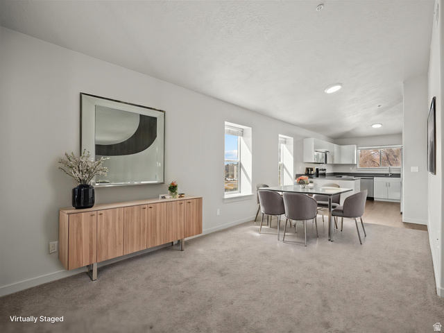 64 West 600 South, Unit C301 Springville, UT 84663 - Photo 5 of 40 Open-concept living space featuring light gray carpeting, recessed lighting, and multiple windows providing natural light