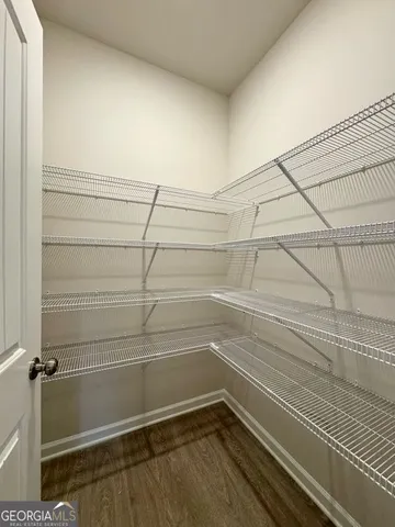 a view of a room with racks on the wall