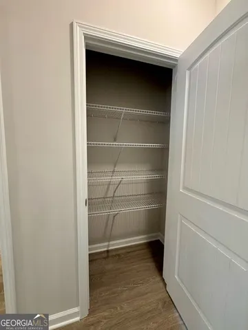 a kitchen with kitchen island granite countertop a sink window and refrigerator