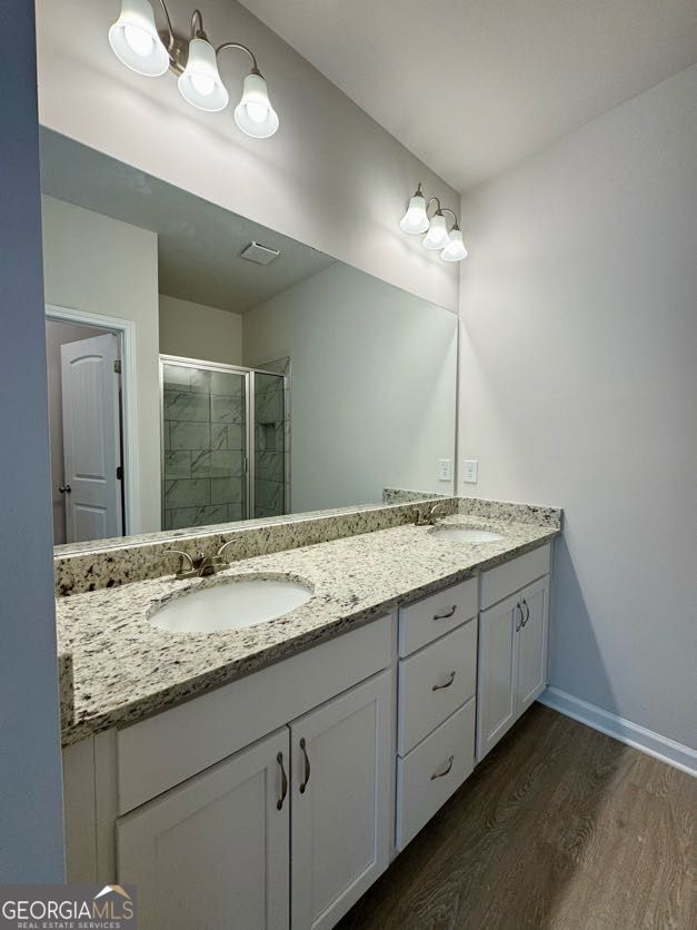 0 Harvest Church Road Clarkesville, GA 30523 - Photo 28 of 33 a bathroom with a granite countertop sink and a mirror