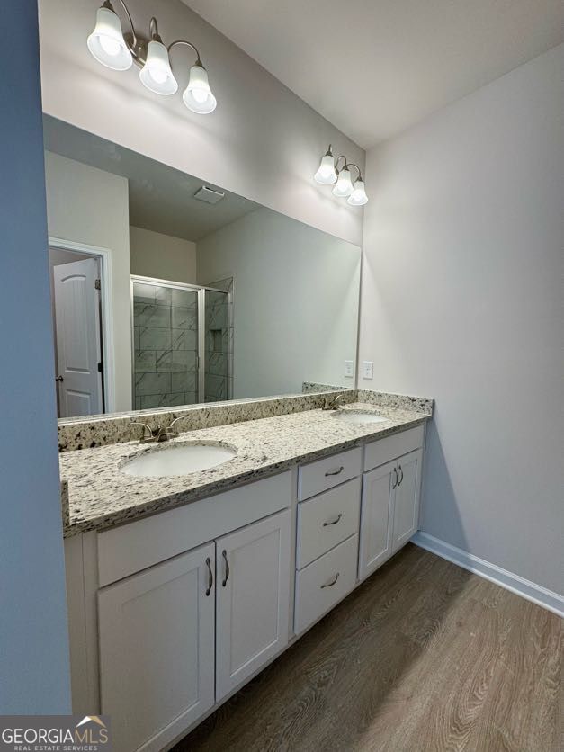 0 Harvest Church Road Clarkesville, GA 30523 - Photo 29 of 33 a bathroom with double vanity sink a vanity and a large mirror
