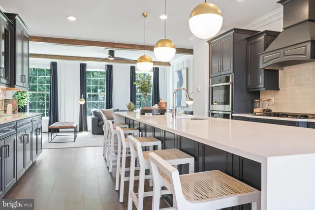 a kitchen with counter top space a sink and appliances
