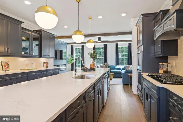 a kitchen with stainless steel appliances granite countertop a stove and a refrigerator