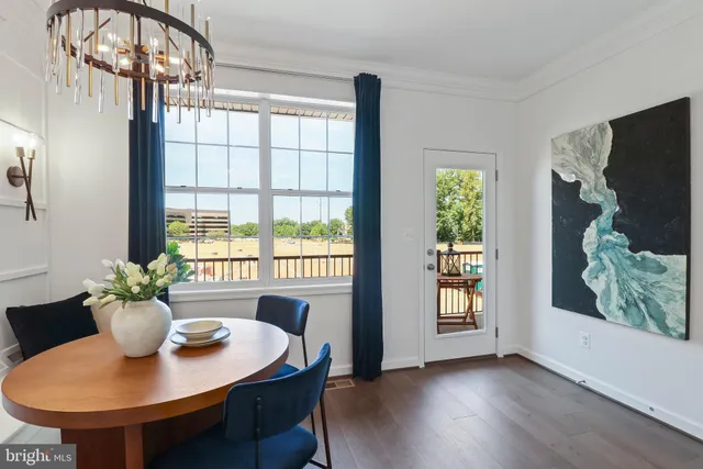 a kitchen with stainless steel appliances granite countertop a sink and a stove