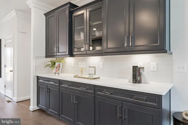 a view of a room with wooden floor and windows