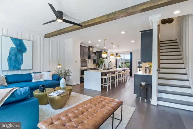 a large kitchen with lots of counter space a sink appliances and cabinets