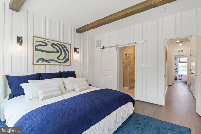 a bedroom with a bed and a dresser