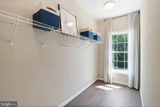 a bedroom with bed and a window