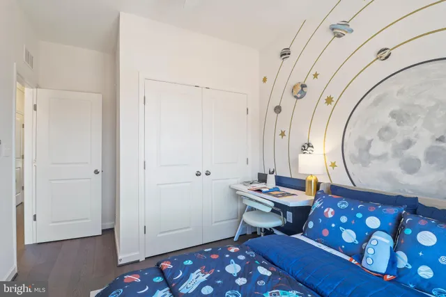 a view of a building next to a yard