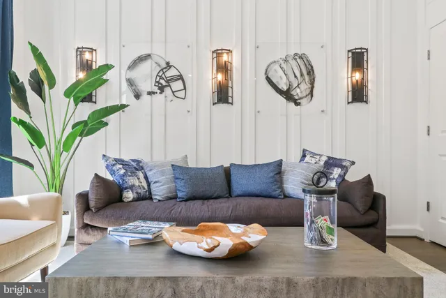 a living room with furniture a table and decor