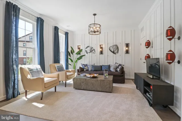 a living room with fireplace furniture and a window