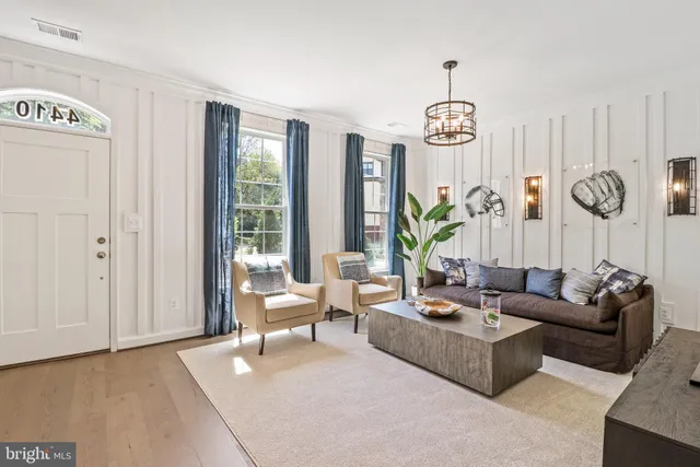 a living room with patio furniture and a window