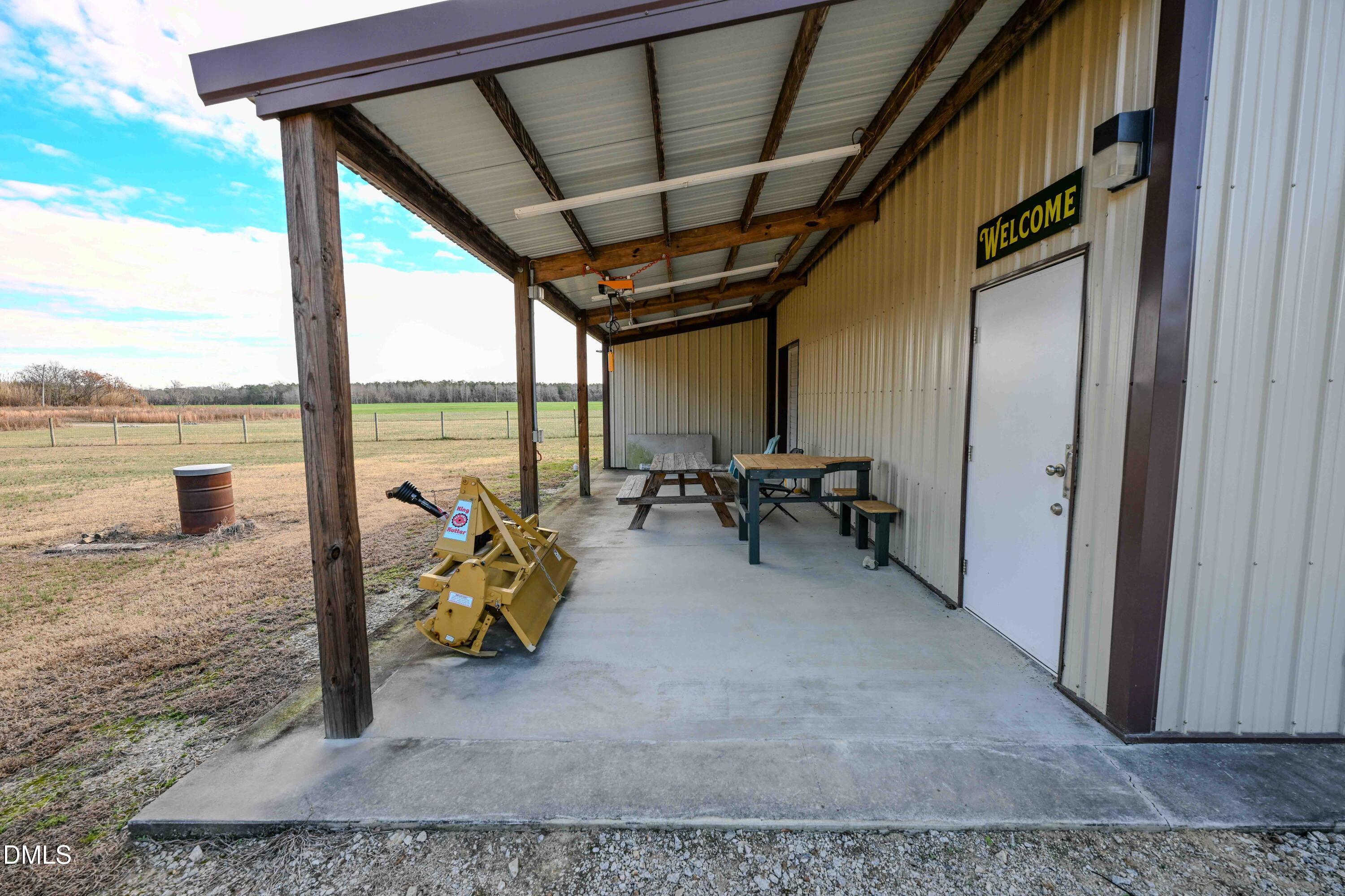 2729 McNeill Hobbs Road Bunnlevel, NC 28323 - Photo 15 of 75 a view of living room with furniture and floor to ceiling window