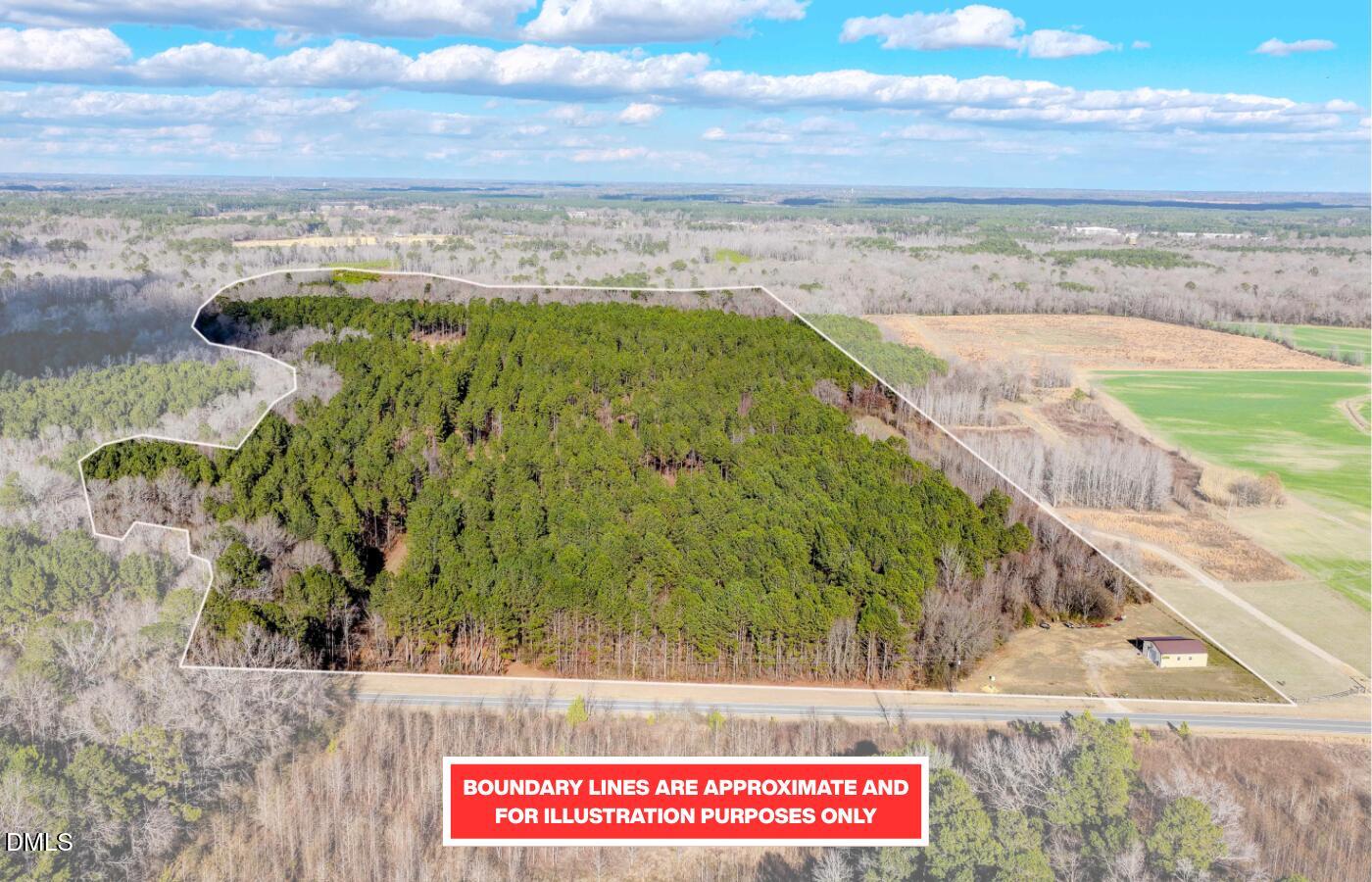 2729 McNeill Hobbs Road Bunnlevel, NC 28323 - Photo 3 of 75 a view of a yard with an ocean view