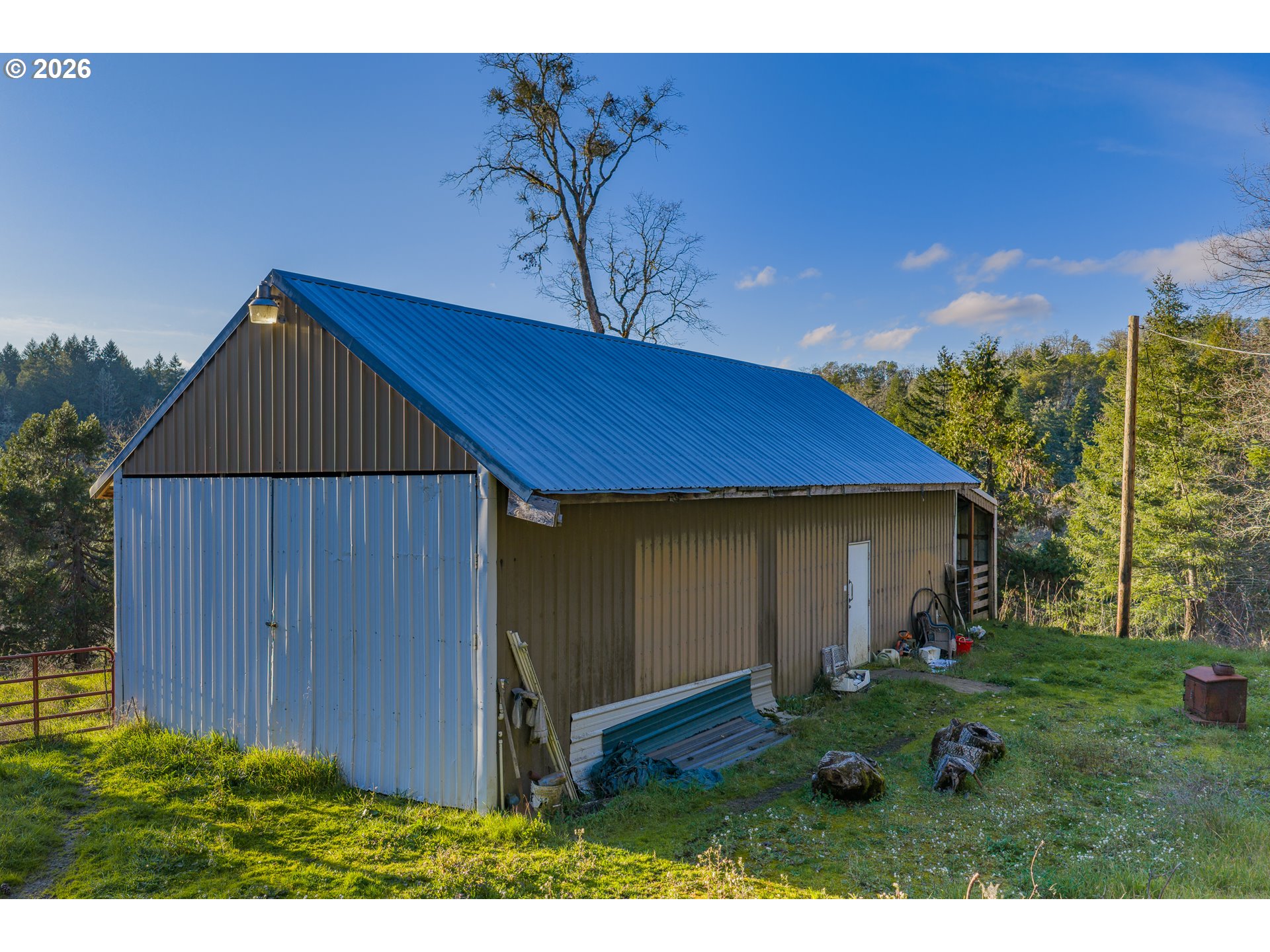 2409 Ireland Road Winston, OR 97496 - Photo 11 of 39 a view of backyard of house