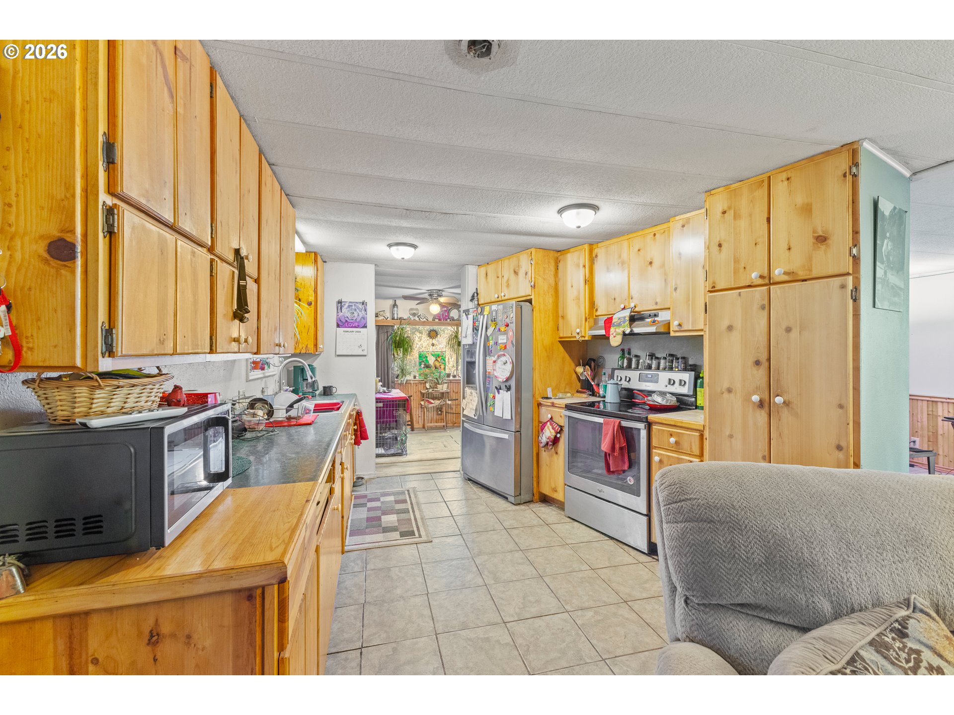 2409 Ireland Road Winston, OR 97496 - Photo 15 of 39 a living room with furniture and a large window