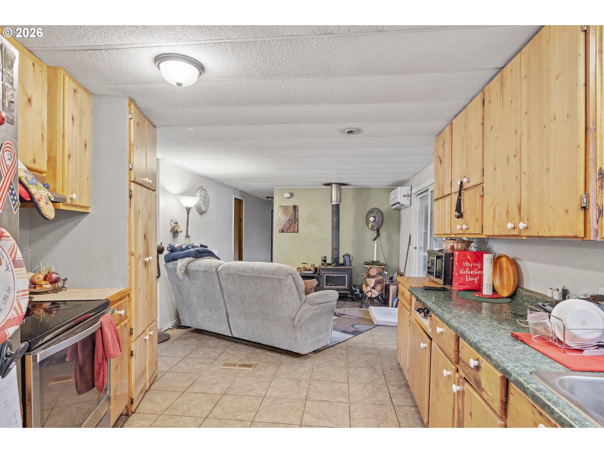 2409 Ireland Road Winston, OR 97496 - Photo 17 of 39 a living room with furniture and a window