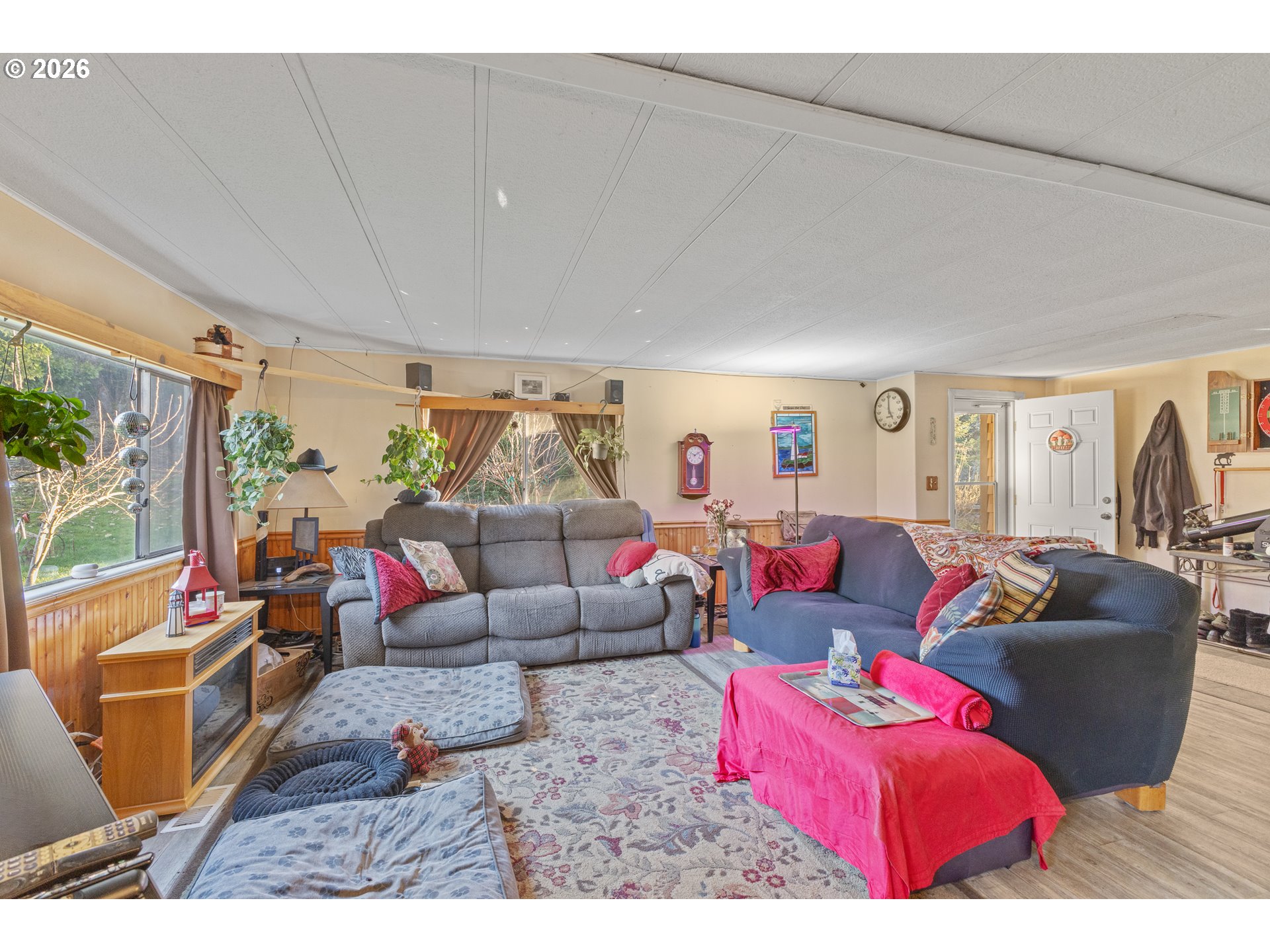 2409 Ireland Road Winston, OR 97496 - Photo 20 of 39 a living room with furniture and a large window