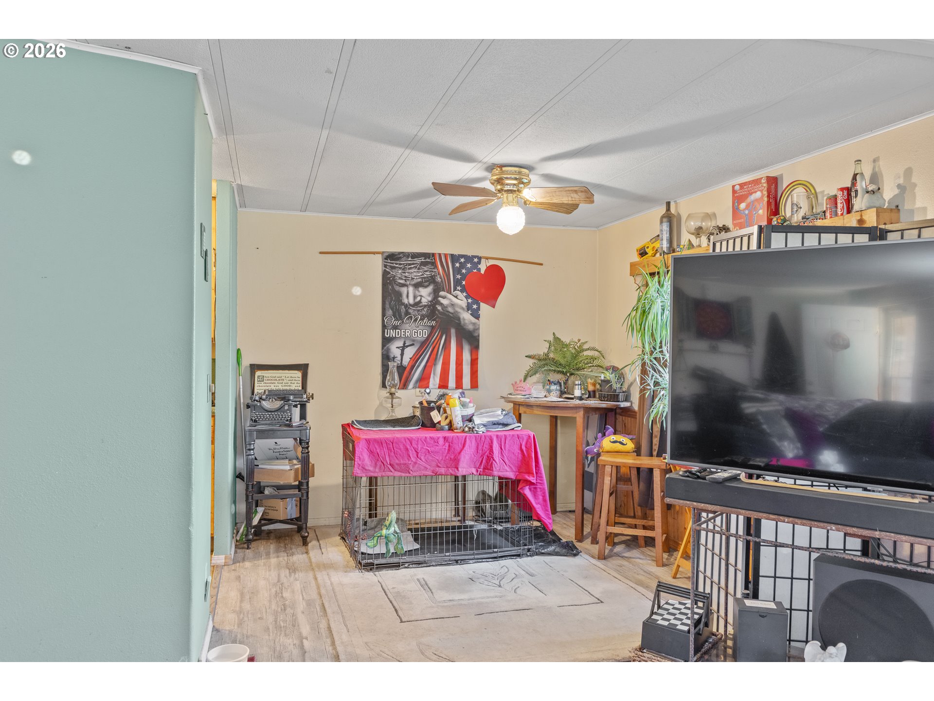 2409 Ireland Road Winston, OR 97496 - Photo 21 of 39 a living room with furniture and a flat screen tv