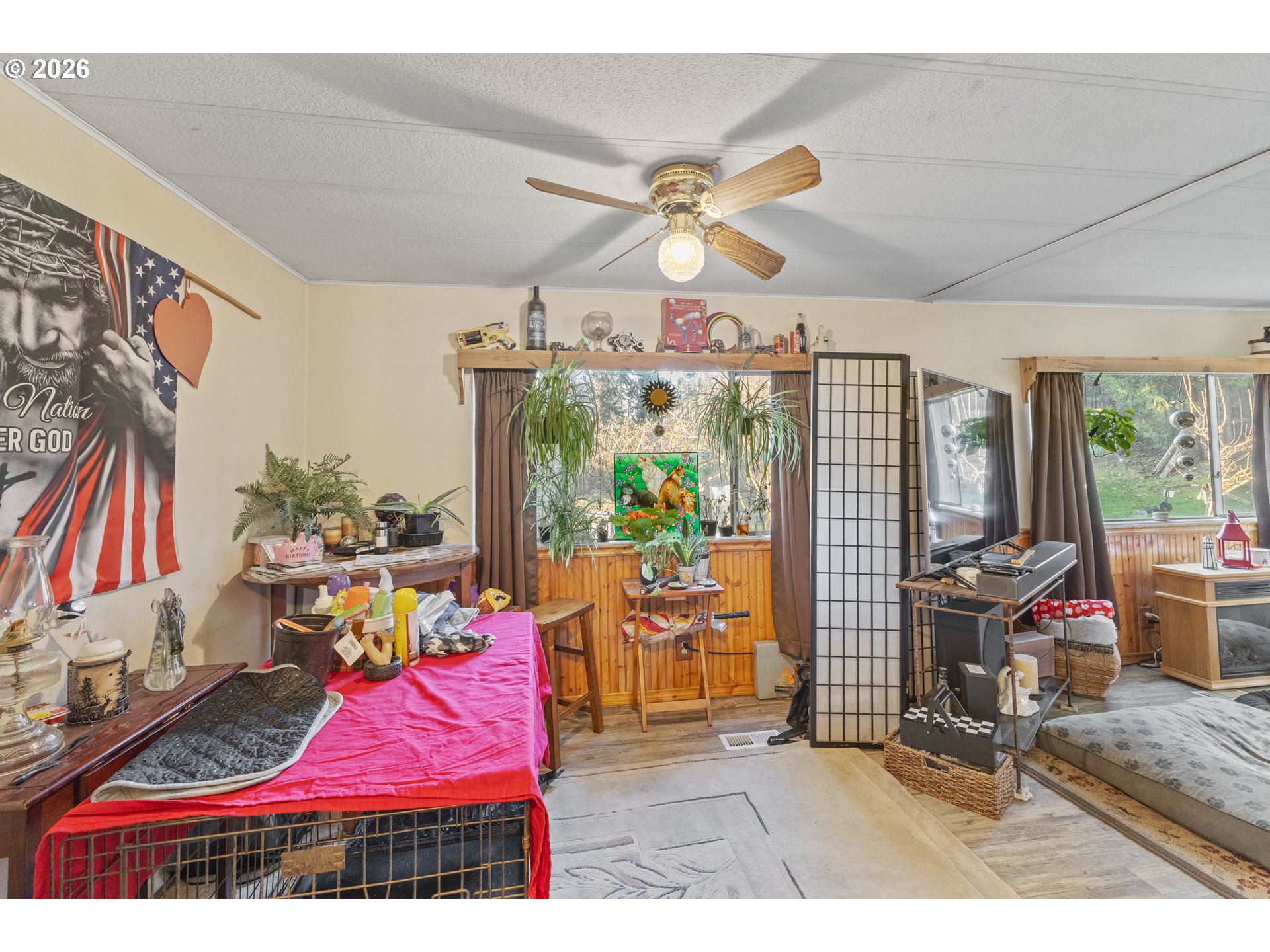 2409 Ireland Road Winston, OR 97496 - Photo 23 of 39 a view of living room with patio furniture and a flat screen tv