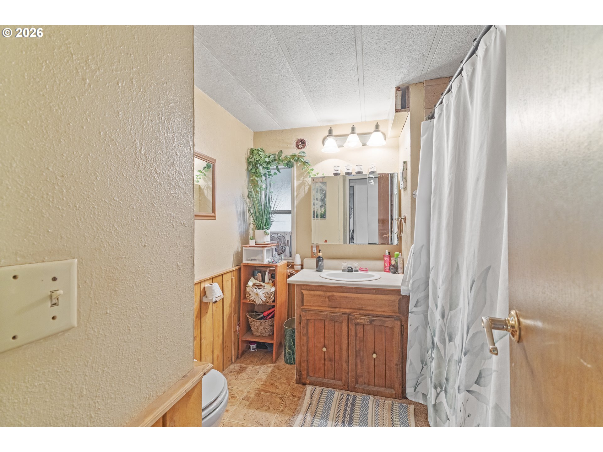 2409 Ireland Road Winston, OR 97496 - Photo 27 of 39 a bathroom with a sink a toilet and a mirror