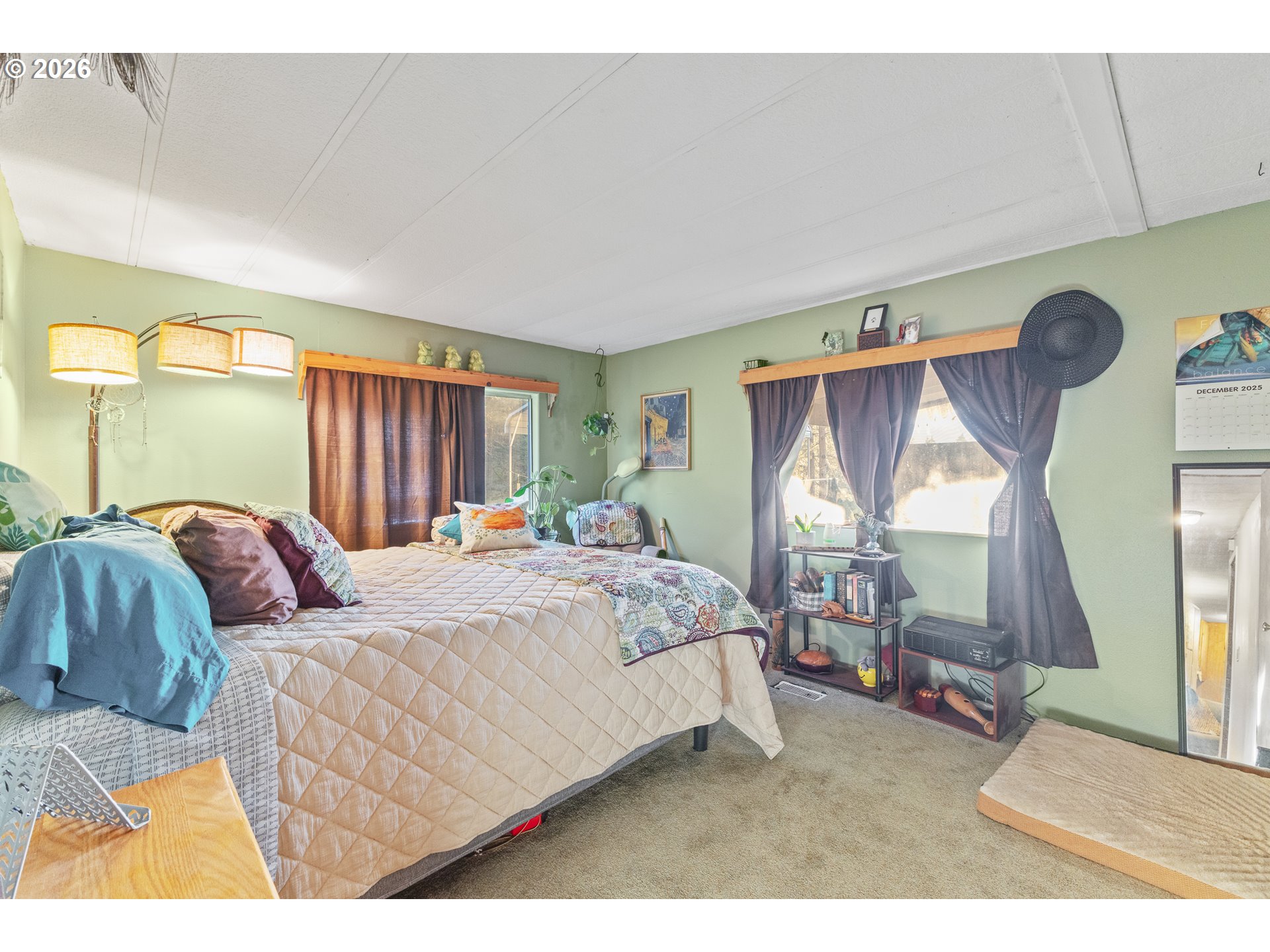 2409 Ireland Road Winston, OR 97496 - Photo 31 of 39 a bedroom with a bed window and a couch