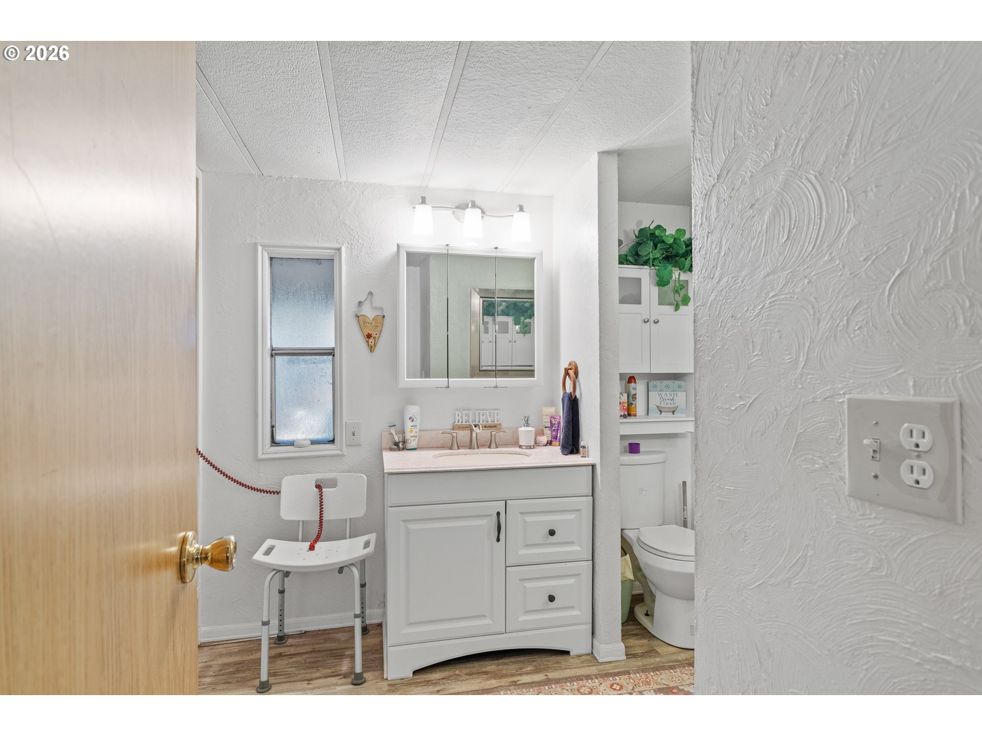 2409 Ireland Road Winston, OR 97496 - Photo 33 of 39 a bathroom with a sink toilet and mirror