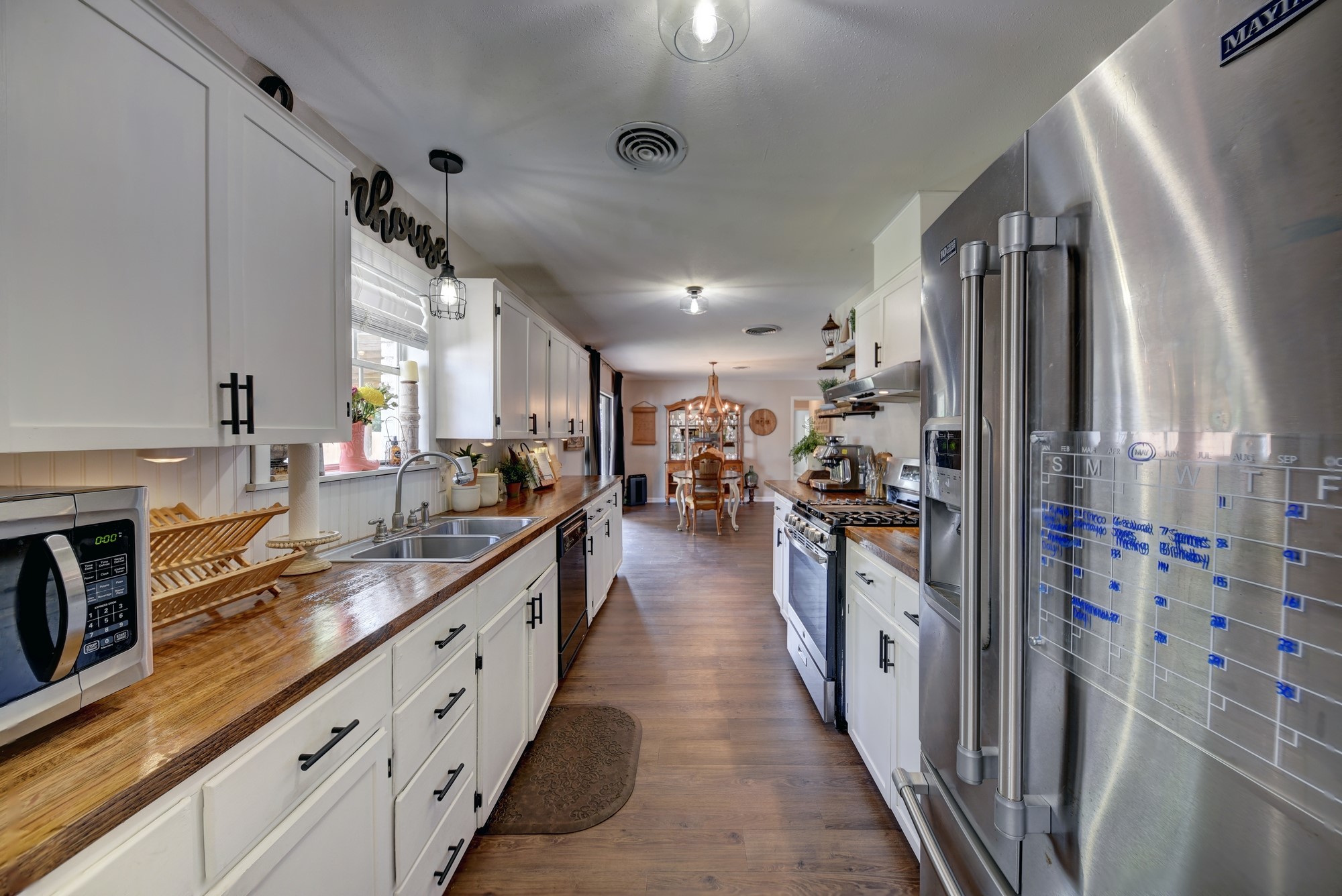 507 Sandra Drive Brenham, TX 77833 - Photo 11 of 30 a large kitchen with cabinets